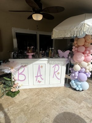 Aria’s Fairy First - This particular event was a first birthday! It was pastels colors, filled with fairies , florals and butterflies. We customized the bar to the theme, we added 3 signature cocktails the client was able to choose from our 30+ menu. We also customized an acrylic butterfly menu, drink stirs and edible drink toppers. Aria’s Fairy First - This particular event was a first birthday! It was pastels colors, filled with fairies , florals and butterflies. We customized the bar to the theme, we added 3 signature cocktails the client was able to choose from our 30+ menu. We also customized an acrylic butterfly menu, drink stirs and edible drink toppers.