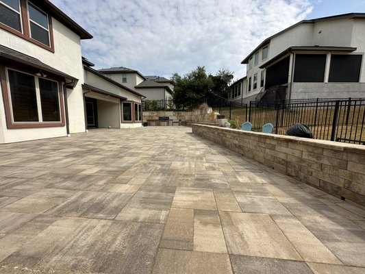 Backyard outdoor living space. - This is a great space that we installed for the homeowner who was tired of dead grass and a severely sloped yard. We fixed it with the retaining wall and Pavers with the barbecue island and it looks fantastic. ￼