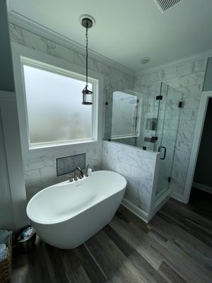 Bathroom remodel 2025 - Completed a full bathroom remodel featuring a custom-built walk-in shower with a sleek glass enclosure and a comfortable soaking tub, designed for both style and functionality. Installed large-format tile throughout to create a clean, modern look with minimal grout lines, complemented by durable, high-quality flooring. The project was finished with the installation of a privacy window to bring in natural light while maintaining discretion. Every detail was carefully executed to deliver a polished, high-end result that enhances both the appearance and value of the space. Bathroom remodel 2025 - Completed a full bathroom remodel featuring a custom-built walk-in shower with a sleek glass enclosure and a comfortable soaking tub, designed for both style and functionality. Installed large-format tile throughout to create a clean, modern look with minimal grout lines, complemented by durable, high-quality flooring. The project was finished with the installation of a privacy window to bring in natural light while maintaining discretion. Every detail was carefully executed to deliver a polished, high-end result that enhances both the appearance and value of the space.