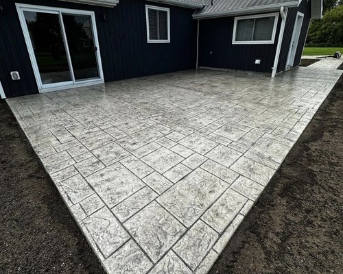 Back patio stamped concrete - This project was done on a patio that was failing, and they needed to upgrade the looks of their backyard. Everything was done to industry standards, which included baserock rebar and expansion joints
