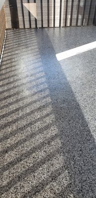 Encino patio epoxy - this is a 3rd floor patio in Encino  that the homeowner was very unhappy with we had a couple of solutions 
but at the end the homeowner decided that due to HOA regulations epoxy was the best approach due to adding more weight to the patio, epoxy was the lightest and more efficient choice. they went with a midnight greyand gloss top coat  and it looks fantastic.