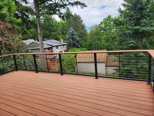 12x20 Deck with Drainage System - Timbertech Azek Vintage – Cypress Decking boards and fascia 
Cable railing system with cocktail rail to match decking 
EPDM Drainage to create a dry space bellow the deck
Cedar soffit to hide the drainage system