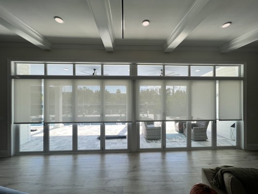 Residential Roller Shades - These motorized ESCREEN roller shades give the client privacy while not losing their beautiful views! Connecting with their smart home system and phone app you and can also control these shades with Alexa! Residential Roller Shades - These motorized ESCREEN roller shades give the client privacy while not losing their beautiful views! Connecting with their smart home system and phone app you and can also control these shades with Alexa!