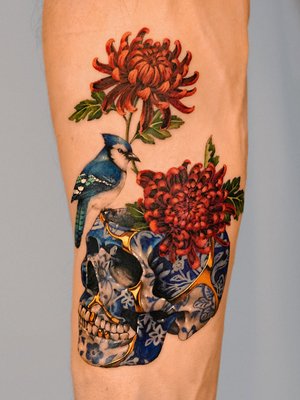 Porcelain Style - Vism Studio's porcelain-style tattoos are ethereal compositions that blend delicate blue hues with intricate linework, reminiscent of fine China patterns. These designs often feature a harmonious fusion of tradition and contemporary artistry.