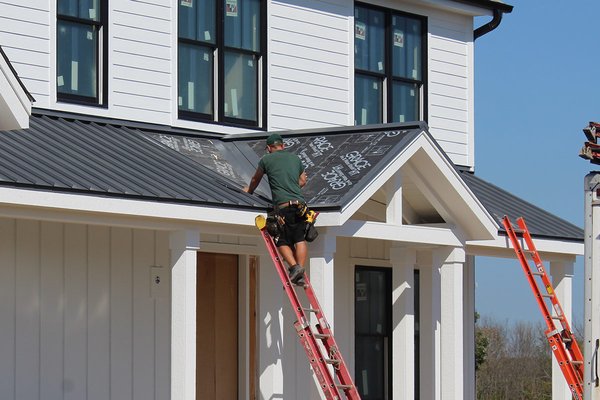Mequon, WI - Metal Roofing - We at BCI Exteriors really enjoy working with builders, such as Victory Homes. Together we offer quality craftsmanship with a keen attention to detail to better serve the customers’ needs and make their custom home stand out. For this newly constructed house out in Mequon, BCI installed standing seam metal accent roofs.
