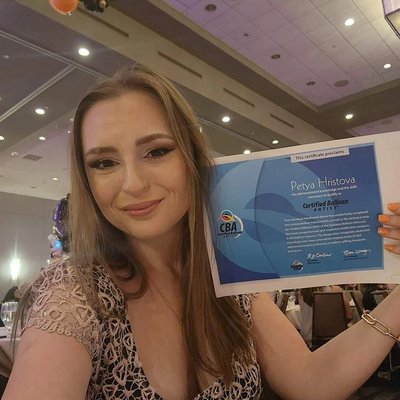 Meet Petya, Your Certified Balloon Artist - I have been a balloon artist for 8 years. Recently I took a big step forward my balloon art journey by taking the CBA test. I'm excited to share that I've officially become a Certified Balloon Artist (CBA)!
You might be wondering what it takes to earn this certification. Well, it's more than just blowing up balloons! It involves passing three online exams, showcasing my work in a portfolio, completing a four-hour practical exam, and an in-person interview.This means I've mastered everything from balloon designs to safety measures, business practices, marketing strategies, and more! Meet Petya, Your Certified Balloon Artist - I have been a balloon artist for 8 years. Recently I took a big step forward my balloon art journey by taking the CBA test. I'm excited to share that I've officially become a Certified Balloon Artist (CBA)!
You might be wondering what it takes to earn this certification. Well, it's more than just blowing up balloons! It involves passing three online exams, showcasing my work in a portfolio, completing a four-hour practical exam, and an in-person interview.This means I've mastered everything from balloon designs to safety measures, business practices, marketing strategies, and more!