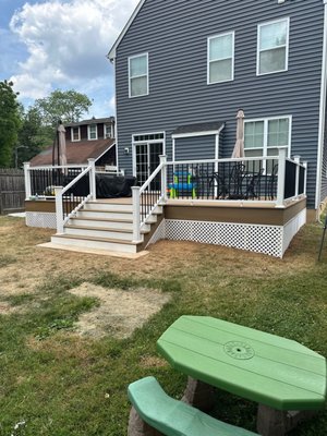 Deck Replacement and Expansion with Trex Composite - This project involved removing an aging wood deck and replacing it with a Trex composite decking system while also expanding the footprint to create additional usable outdoor space. The original deck boards and railing had deteriorated and no longer met the homeowner’s needs.

We reframed and extended the deck structure to increase square footage, then installed new Trex decking for improved durability and low maintenance performance. An updated railing system completed the build, providing a clean, modern look with added safety and structural integrity.

The finished result delivers more entertaining space, better flow to the yard, and a long term solution that eliminates the upkeep requirements of traditional wood decking.