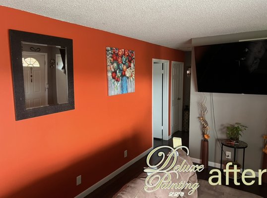 Custom design on wall - The client envisions a vibrant transformation for her living room with a bold orange accent wall. This lively color is intended to inject warmth and energy into the space, creating a focal point that draws the eye. The orange wall will harmonize beautifully with neutral furnishings, allowing for a lively contrast that energizes the room. She plans to complement the wall with artwork featuring warm tones and natural textures, creating a dynamic yet cozy atmosphere. The overall design aims to evoke a sense of creativity and positivity, making the living room an inviting space for relaxation and socializing. Custom design on wall - The client envisions a vibrant transformation for her living room with a bold orange accent wall. This lively color is intended to inject warmth and energy into the space, creating a focal point that draws the eye. The orange wall will harmonize beautifully with neutral furnishings, allowing for a lively contrast that energizes the room. She plans to complement the wall with artwork featuring warm tones and natural textures, creating a dynamic yet cozy atmosphere. The overall design aims to evoke a sense of creativity and positivity, making the living room an inviting space for relaxation and socializing.