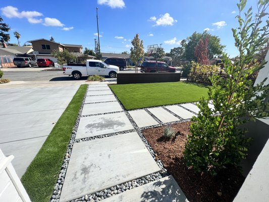 San Jose, CA - This was a front yard project in San Jose, CA. We did modern landscape installation, with poured in place concrete pads. We also did a Horizontal IPE fence, and artificial grass.