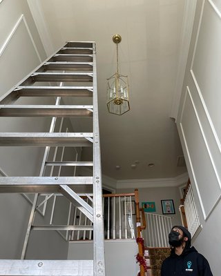 Chandelier installs on 20 foot ceiling and 12 foot ceiling. - Chandelier install on 20 foot ceiling with 16 foot ladder and chandelier install on 12 foot ceiling.