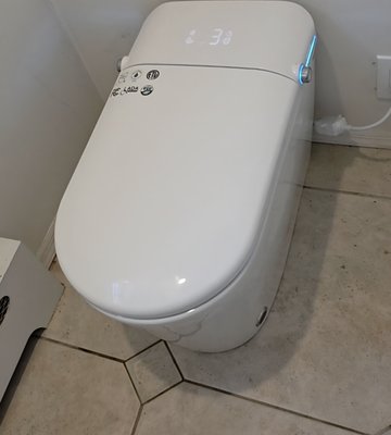 Smart toilet installation - This old toilet was removed and the customer wanted to upgrade and try out a smart toilet. I was quite impressed because it's completely hands-free simple to install and has so many options to explore.This smart toilet is self cleaning, the toilet seat opens and closes on its own, it has temperature and pressure controls for the bidet feature and even has air drying capabilities