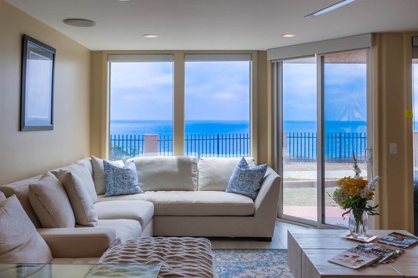 Vacation Rental - Del Mar Shores Terrace - Gorgeous 1 bedroom condo overlooking the pacific ocean. Enjoy the sounds of the ocean, breezes and stunning sunsets from this updated 1 bedroom.   Get some rest and rejuvenation in the King bed, go for a swim in the pool, or take a stroll down to the beach using the complex's beach access.  This complex is just a short distance to the Beachwalk Center which has food, dry cleaners, coffee and so much more to offer!  Fletcher cove is a great spot for a picnic or a stop at the playground.  1 assigned parking space in gated garage.