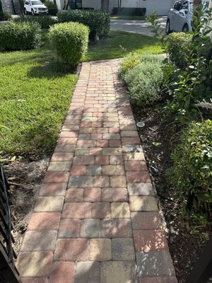 Walkway Removal & Install - This walkway was removed and concrete underneath was also removed. We applied 4" of compacted limerock base and installed new pavers. The owner was having issues with the lawn mower lifting the mudset 3/4" pavers that were installed and caused a tripping hazard.