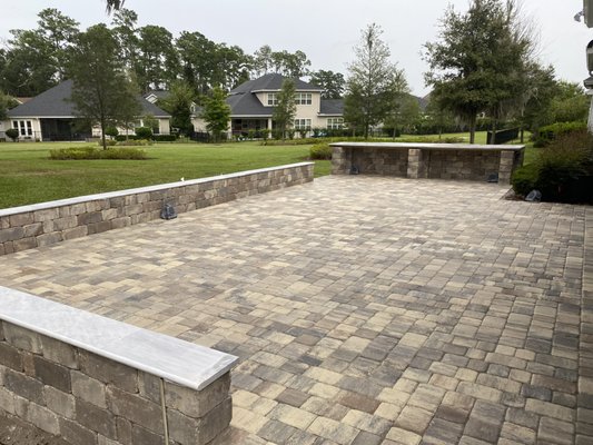 Raised Patio w/ Perimeter Seating and Outdoor Countertop - We built this 1,000 sq-ft raised patio for a customer in Southside. They wanted a large entertainment space with lots of seating and a large outdoor countertop. We also added exterior lighting and sound to add to the ambience. They were very happy with the result! Raised Patio w/ Perimeter Seating and Outdoor Countertop - We built this 1,000 sq-ft raised patio for a customer in Southside. They wanted a large entertainment space with lots of seating and a large outdoor countertop. We also added exterior lighting and sound to add to the ambience. They were very happy with the result!