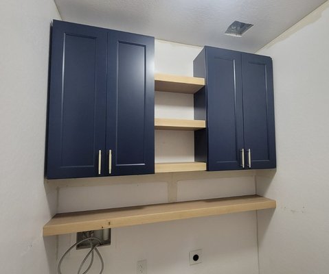 Laundry Room Cabinet Package - This laundry room remodel perfectly blends functionality with modern design. The project features two sleek wall-mounted cabinets that provide ample storage for detergents, cleaning supplies, and other essentials, keeping the space organized and clutter-free.

To enhance the aesthetic and add versatility, we incorporated custom floating shelves between the cabinets. These shelves offer an open, airy feel, ideal for displaying decorative accents or keeping everyday items within easy reach.

The result is a beautifully upgraded laundry space that's both practical and stylish, making daily chores more enjoyable and efficient.