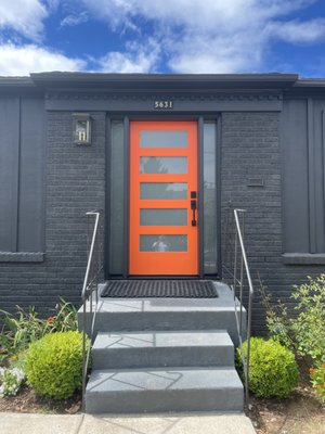 Front Door Upgrade - This client in the Concordia neighborhood of Northeast Portland wanted more natural light at the entry and a stronger visual impact. We removed the old solid door and modified wood paneling that had been covering original glass block side windows. The new fiberglass door and clear side lights make the space brighter and more welcoming. The bold orange finish adds a modern pop against the dark exterior. Always great to work on a project right here in my own neighborhood. Front Door Upgrade - This client in the Concordia neighborhood of Northeast Portland wanted more natural light at the entry and a stronger visual impact. We removed the old solid door and modified wood paneling that had been covering original glass block side windows. The new fiberglass door and clear side lights make the space brighter and more welcoming. The bold orange finish adds a modern pop against the dark exterior. Always great to work on a project right here in my own neighborhood.