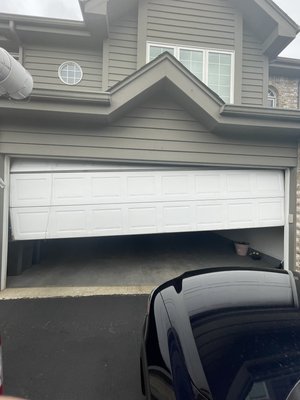 Garage Door Repair - Garage Door Cable rusted through and snapped. Door is off track and crooked. Garage Door Repair - Garage Door Cable rusted through and snapped. Door is off track and crooked.