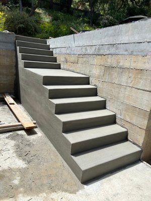 Concrete Staircase - This custom concrete staircase was designed to provide easy access to the upper level, eliminating the need to walk around the entire house. The homeowner is thrilled with the result—functional, convenient, and stylish! Concrete Staircase - This custom concrete staircase was designed to provide easy access to the upper level, eliminating the need to walk around the entire house. The homeowner is thrilled with the result—functional, convenient, and stylish!