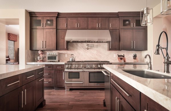 Las Vegas "Durango Ranch" - This house had good structure and flow for the kitchen. The original products the builder used for the kitchen were low to mid grade. We removed the soffits, re designed the layout to work with new upgraded appliances. New Taj Mahal Quartzite slabs. New Cherry "Cabinetry by Karman" cabinets. And a Steam shower in the Master bath