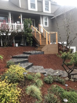 Hardscape walkway - Paver walkway leading up to a composite deck. Railing was cedar & cables. Hardscape walkway - Paver walkway leading up to a composite deck. Railing was cedar & cables.