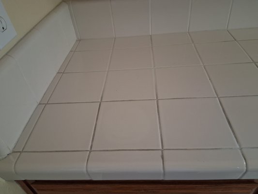 Tile Kitchen countertop - This countertop we cleaned, sealed, and caulked the sink. It really brightened up the entire kitchen and looks brand new! The customer was thrilled. Tile Kitchen countertop - This countertop we cleaned, sealed, and caulked the sink. It really brightened up the entire kitchen and looks brand new! The customer was thrilled.