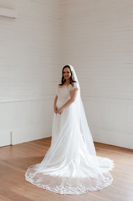 Refurbished Mother's Bridal Gown for Daughter - I worked with Bride Maggie on altering her mother's gown to fit her size and style. 
We removed the poofy sleeves and replaced them with lace cap sleeves. I also removed some poof from the veil and raised the waist to her natural waist instead of the original drop waist.