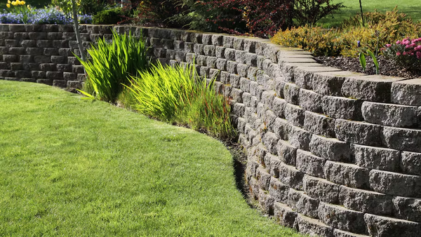 Residential & Commercial Retaining Walls - At Brother in Law Landscape we are a residential and commercial landscape company with over 15 years of experience keeping customers happy. We focus on installing beautiful local plant material (trees/shrubs/perennials), natural stone or clay brick patios, walkways, retaining walls, firepits, driveways, outcropping stone, ponds, and more.
