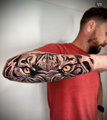Realism Tattoos - Photorealism is exactly what it sounds like! A style of tattooing that focuses on creating designs that look just like photographs. Great for commemorating your favorite person, animal, landscape, object or design.