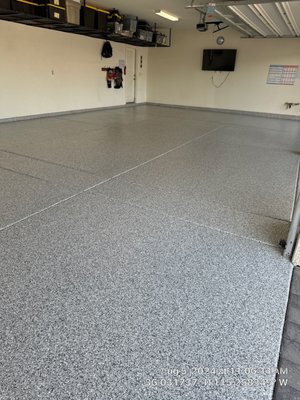 Enterprise Residence - This 900 sqft. 4-car garage coated in our Evolution System with beautiful Slate Stone flakes looks amazin! This system is made of 99.5% polyurea solids to give it superior durability, including chemical, abrasion, and UV resistance. We repaired the customer's existing cracks in the substrate prior to coating and even coated the stem walls around the perimeter for a more complete look. All backed by a manufacturer lifetime warranty.