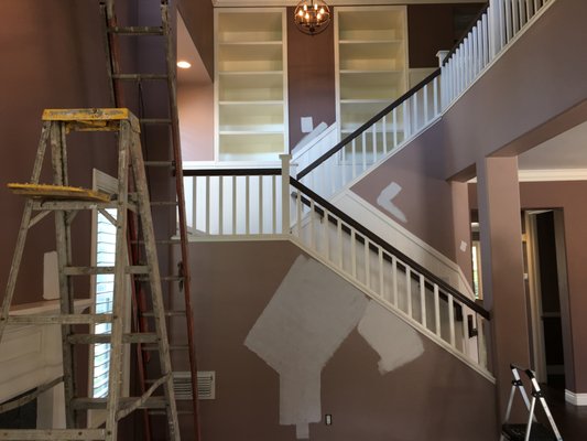 Staircase Makeover in Irvine Area - The living rooms and staircase with two tone dark purple. We went with a beautiful white color. They loved it!