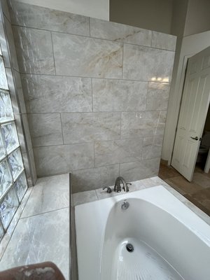 Bathroom Remodel ~ March 2026 - This bathroom remodel involved demolishing the existing slate stone tiles and replacing them with Perla Venata polished porcelain.
The existing slate tiles showed massive erosion due to persistent water intrusion. We demoed down to the studs and built back with DensShield waterproof backer board and Red Guard.
The new porcelain adds more warmth to the bathroom, is inherently more water resistant, and requires much less upkeep as compared to natural slate stone tiles. Bathroom Remodel ~ March 2026 - This bathroom remodel involved demolishing the existing slate stone tiles and replacing them with Perla Venata polished porcelain.
The existing slate tiles showed massive erosion due to persistent water intrusion. We demoed down to the studs and built back with DensShield waterproof backer board and Red Guard.
The new porcelain adds more warmth to the bathroom, is inherently more water resistant, and requires much less upkeep as compared to natural slate stone tiles.