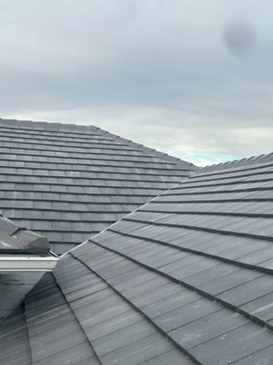 Westlake Saxony 900 Slate Concrete Tile Roof Replacement | Windermere, FL - Our team completed a full roof replacement on this beautiful home in Windermere, installing Westlake Royal Saxony 900 Slate concrete flat tile in the Dark Charcoal Blend color. This premium tile provides a sleek, modern slate look while delivering the durability and weather resistance needed for Florida’s climate.
For long-term protection, we installed a premium high-temperature peel-and-stick underlayment, creating a fully adhered waterproof barrier beneath the tile system. This helps protect the home from wind-driven rain and extreme heat while extending the service life of the roof.
From precise layout and flashing details to proper fastening and ventilation, every step was completed to meet or exceed Florida Building Code standards. The finished product delivers a stunning architectural upgrade with exceptional performance and peace of mind for the homeowner. Westlake Saxony 900 Slate Concrete Tile Roof Replacement | Windermere, FL - Our team completed a full roof replacement on this beautiful home in Windermere, installing Westlake Royal Saxony 900 Slate concrete flat tile in the Dark Charcoal Blend color. This premium tile provides a sleek, modern slate look while delivering the durability and weather resistance needed for Florida’s climate.
For long-term protection, we installed a premium high-temperature peel-and-stick underlayment, creating a fully adhered waterproof barrier beneath the tile system. This helps protect the home from wind-driven rain and extreme heat while extending the service life of the roof.
From precise layout and flashing details to proper fastening and ventilation, every step was completed to meet or exceed Florida Building Code standards. The finished product delivers a stunning architectural upgrade with exceptional performance and peace of mind for the homeowner.