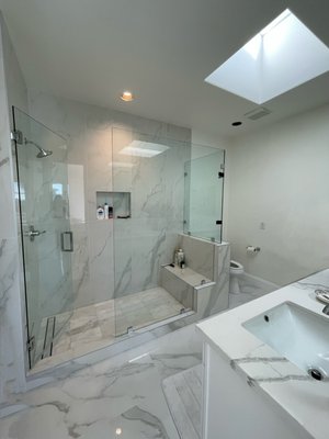 Brand New Bathroom in Rancho Santa Fe - A complete bathroom transformation with a new walk-in shower, frameless glass door, large-format porcelain tiles, and a custom vanity. The space feels brighter and more open, combining modern elegance with durable finishes.