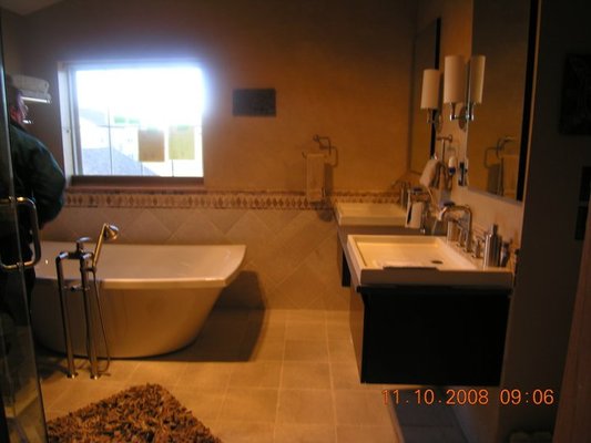 2 Bath Remodels in Vernon Hills, IL - Master Bath features free-standing tub, floating vanities and custom shower with digital controls