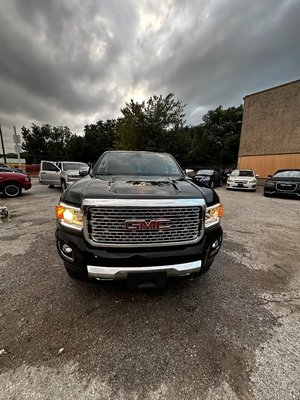 2019 GMC CANYON DENALI - this GMC Canyon Denali:

For sale is a stunning 2019 GMC Canyon Denali pickup truck in a sleek black exterior color. This truck is in excellent condition and has a powerful 3.6L V6 engine with 308 horsepower and 275 ft-lbs of torque, providing impressive performance on and off the road. It features a 4X4 drivetrain and an automatic transmission for smooth and effortless driving.

The exterior of this Canyon Denali is complemented by its stylish alloy wheels and a bed liner, adding both functionality and aesthetic appeal. The interior is equally impressive, with black leather upholstery that is both comfortable and luxurious. The heated and cooled leather seats provide maximum comfort in any weather condition.

This GMC Canyon Denali is packed with modern features and technology. It includes Bluetooth connectivity, allowing you to easily connect your phone for hands-free calling and music streaming. The navigation system ensures that you never get lost on your adventures. The backup camera provides added safety and convenience when parking or maneuvering in tight spaces.

Other notable features of this Canyon Denali include satellite radio, voice recognition, power outlets, a heated steering wheel, and an anti-theft system for added security. With seating for five and four doors, this crew cab pickup offers ample space for both passengers and cargo.

This truck has a towing capacity of 7,000 lbs, making it perfect for hauling trailers, boats, or other heavy loads. It also has a fuel efficiency rating of 24 MPG on the highway and 17 MPG in the city, providing a balance of power and efficiency.

Overall, this 2019 GMC Canyon Denali is a top-of-the-line pickup truck that combines style, performance, and luxury. It is in excellent condition and ready for its next owner to enjoy all that it has to offer. Don't miss out on the opportunity to own this impressive vehicle. Contact us today to schedule a test drive or for more information.

Make: GMC Model: Canyon Trim: Denali Year: 2019 Exterior Color: Black Interior Color: Black Body Type: Pickup Cab Type: Crew Cab Doors: 4 Seats: 5 Seat Rows: 2 Drivetrain: 4X4 Transmission Type: Automatic Fuel Type: Gas Cylinders: 6 Engine Displacement: 3.6 LEngine Power: 308 HP (Truck avg: 327)Engine Torque: 275 ft-lbs (Truck avg: 376)Towing Capacity: 7,000 lbs (Truck avg: 6536)