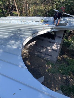 Standing Seam Metal Roof Install - This roof was installed in central Austin, TX. We installed a Carlisle WIP 300HT waterproofing underlayment and a standing seam metal roof on top of that. Love the half moon detail! Standing Seam Metal Roof Install - This roof was installed in central Austin, TX. We installed a Carlisle WIP 300HT waterproofing underlayment and a standing seam metal roof on top of that. Love the half moon detail!