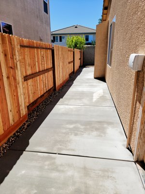 Brushed Concrete & Fence - We did a major cleanup to this house. Removed existing fence and concrete. Installed new Redwood fence with 8 inch Kickboard and 850 sqft. of concrete. For this project we had to use a concrete pump. With 3 highly experienced finishers concrete was poured and finished in under 4 hours. Brushed Concrete & Fence - We did a major cleanup to this house. Removed existing fence and concrete. Installed new Redwood fence with 8 inch Kickboard and 850 sqft. of concrete. For this project we had to use a concrete pump. With 3 highly experienced finishers concrete was poured and finished in under 4 hours.