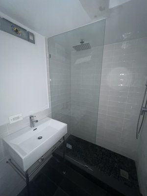 bathroom renovation - This bathroom was gutted and tub was removed as client requested. New plumbing was added with a overhead rain shower, single hand shower body with sprayer. glass panel complements the open feel to the standing shower. bathroom renovation - This bathroom was gutted and tub was removed as client requested. New plumbing was added with a overhead rain shower, single hand shower body with sprayer. glass panel complements the open feel to the standing shower.