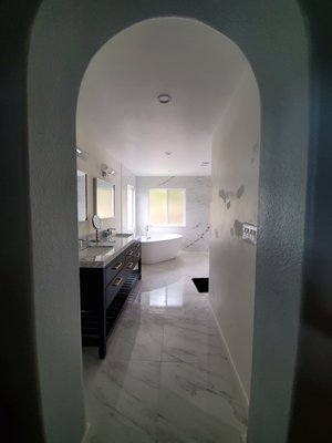 Bath remodeling - This was a complete bathroom Jack and Jill with extra vanity added to bedroom and flooring throughout the house to match.
