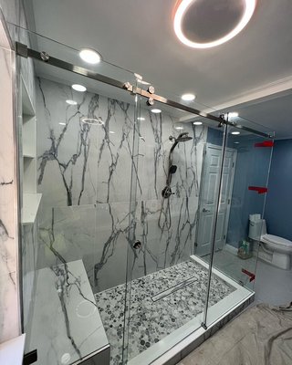Beautiful frameless serenity CRLaurence brushed nickel hardware - This beautiful shower was installed and n concord the homeowner did not wanted a swing door. They wanted a sliding door needed to be frameless. It was a difficult and challenging shower door and at the end of the day customer got exactly what she wanted. Personal I loved the outcome myself Beautiful frameless serenity CRLaurence brushed nickel hardware - This beautiful shower was installed and n concord the homeowner did not wanted a swing door. They wanted a sliding door needed to be frameless. It was a difficult and challenging shower door and at the end of the day customer got exactly what she wanted. Personal I loved the outcome myself