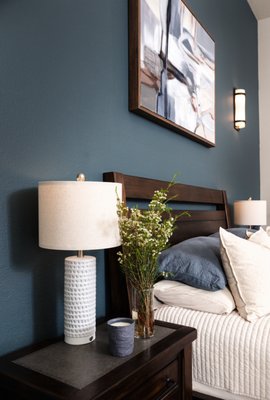 Cozy Color Harmony - Cozy Color Harmony is a warm, inviting space brought to life through thoughtful layering and creative solutions. With a limited budget and many existing furnishings, we focused on enhancing what the client already had by blending colors, adding decor, and replacing key pieces to create a cohesive and comfortable home. From soft sage and terracotta tones to touches of blue, every detail was chosen to bring comfort and personality. This project is a great example of how small changes can make a big impact.