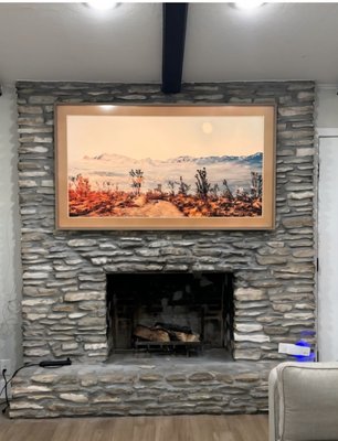 samsung frame TV installation measuring 95" over a stone-coated fireplace. - Each fireplace is beautiful and unique in its own way. when installing a TV on this beautiful fireplace, a unique engineering solution was applied. The location on the wall of this TV frame was agreed by the members of the whole family. now the TV has added coziness to this beautiful house. may joy and happiness always be within the walls of this cozy house.