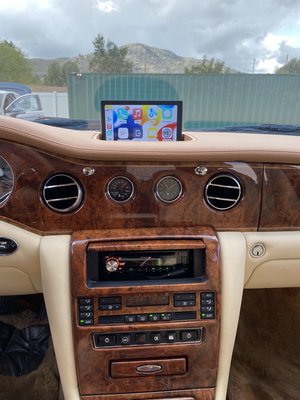 Rolls-Royce Silver Seraph - Apple CarPlay Upgrade - Rolls-Royce Silver Seraph - Upgrades.
Apple CarPlay and Android Auto have been seamlessly integrated, complemented by front and rear cameras for enhanced convenience. The sound system has undergone a complete upgrade, with all speakers replaced and the addition of two subwoofers and headrest monitors for an unparalleled audio-visual experience.
The installation of the Starlight Headliner enhances the car's uniqueness and beauty, making it truly exceptional. Rolls-Royce Silver Seraph - Apple CarPlay Upgrade - Rolls-Royce Silver Seraph - Upgrades.
Apple CarPlay and Android Auto have been seamlessly integrated, complemented by front and rear cameras for enhanced convenience. The sound system has undergone a complete upgrade, with all speakers replaced and the addition of two subwoofers and headrest monitors for an unparalleled audio-visual experience.
The installation of the Starlight Headliner enhances the car's uniqueness and beauty, making it truly exceptional.
