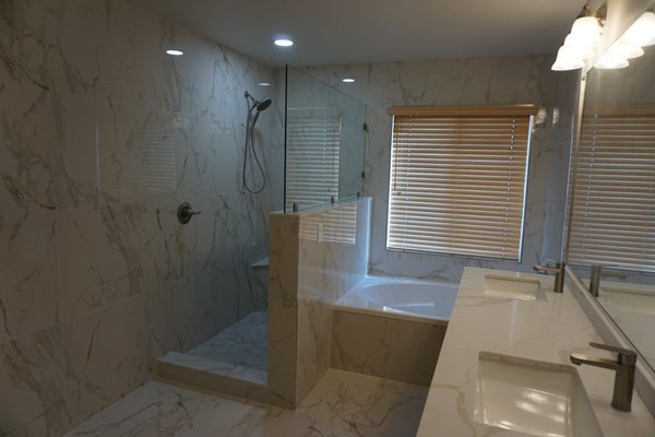 WHITE AND GOLD BATHROOM REMODEL - Total remodel. extended shower with a pony wall. Installed a beautiful white gold and brown tile throughout. WHITE AND GOLD BATHROOM REMODEL - Total remodel. extended shower with a pony wall. Installed a beautiful white gold and brown tile throughout.