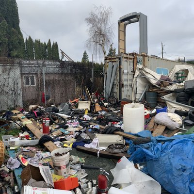 Property Cleanup 45 Metric tons - This Large project was one of the biggest junk removal jobs Fraser Valley Junk Solutions has ever completed. We removed everything including tires,  R.V's, paint cans, garbage, needles and all other remaining debris totalling around 45 metric tons of garbage.