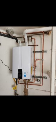 Tankless water heater - This is a navien tankless water heater installed in place of old traditional tank style water heater, upgrading to a more efficient, clean system, providing endless hot water.

Call for quote today!