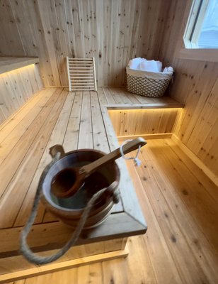 Custom sauna build - Nestled in the serene landscape of the Catskills, New York, is a meticulously crafted wood-burning sauna, exquisitely lined with aromatic cedar. This custom-built sanctuary exudes rustic charm and modern elegance, offering a tranquil retreat from the hustle and bustle of everyday life. The warm, inviting ambiance of the cedar-lined interior creates a sensory experience, enveloping guests in the natural, earthy scent of cedar as they unwind and rejuvenate. The sauna's design seamlessly integrates with its surroundings, featuring large windows that frame breathtaking views of the surrounding wilderness, allowing guests to connect with nature while indulging in the restorative heat of the wood-burning stove. Every aspect of this exceptional sauna, from the precision-cut cedar panels to the thoughtfully designed seating and lighting, reflects a harmonious blend of craftsmanship and functionality, making it a captivating and inviting space for relaxation and renewal in the heart of the Catskills. Custom sauna build - Nestled in the serene landscape of the Catskills, New York, is a meticulously crafted wood-burning sauna, exquisitely lined with aromatic cedar. This custom-built sanctuary exudes rustic charm and modern elegance, offering a tranquil retreat from the hustle and bustle of everyday life. The warm, inviting ambiance of the cedar-lined interior creates a sensory experience, enveloping guests in the natural, earthy scent of cedar as they unwind and rejuvenate. The sauna's design seamlessly integrates with its surroundings, featuring large windows that frame breathtaking views of the surrounding wilderness, allowing guests to connect with nature while indulging in the restorative heat of the wood-burning stove. Every aspect of this exceptional sauna, from the precision-cut cedar panels to the thoughtfully designed seating and lighting, reflects a harmonious blend of craftsmanship and functionality, making it a captivating and inviting space for relaxation and renewal in the heart of the Catskills.