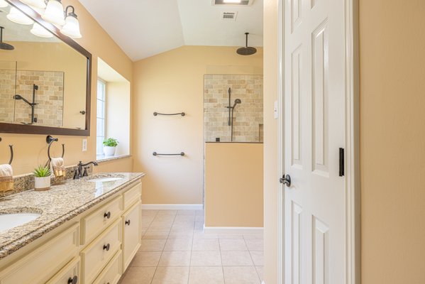 Bathroom Remodel - Embarking on this project was an exhilarating journey that whisked us away to the enchanting shores of Italy. Our clients, freshly inspired by their recent trip to the land of rustic traditional Italian architecture and design, entrusted us with a unique mission: to transform their primary bathroom. The focal points of this home remodel were to infuse it with age-in-place functionality, expand the shower space, and usher in a fresh design perspective. Bathroom Remodel - Embarking on this project was an exhilarating journey that whisked us away to the enchanting shores of Italy. Our clients, freshly inspired by their recent trip to the land of rustic traditional Italian architecture and design, entrusted us with a unique mission: to transform their primary bathroom. The focal points of this home remodel were to infuse it with age-in-place functionality, expand the shower space, and usher in a fresh design perspective.