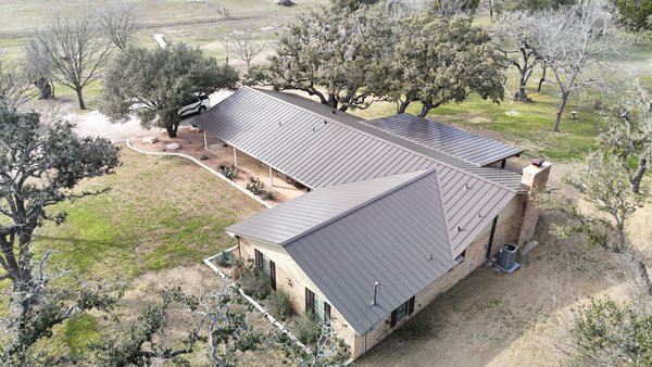 24 Gauge Aged Bronze Snap-Lock Roof, Salado, TX - Full re-roof after the recent hail in Salado, TX. Customer elected to move on from their previous Copper Penny R-Panel to an upgraded 24-gauge Aged Bronze Snap Lock roof system.