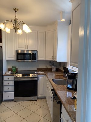 Kitchen remodel (cabinets) - We sanded cabinets before applying the primer. We applied 2 coats of primer. And 2 to 3 coats of paint.